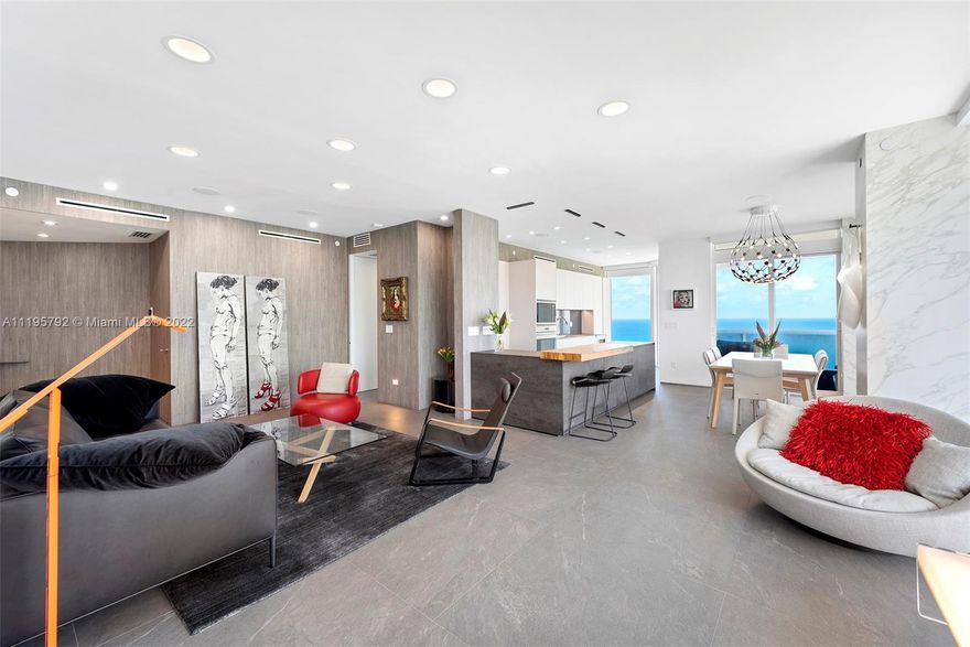 Completely renovated using the finest materials, workmanship, & state-of-the-art features, this residence boasts endless picturesque views of the ocean, bay & cityscape. Ultra-modern 3BR | 3.5 bath w/high ceilings, floor to ceiling glass windows & 2 terraces . The southern exposure adds an abundance of natural light. Outfitted w/stone countertops, high-end appliances and custom cabinetry, the gourmet kitchen, which opens to a large living-dining room, is an epicurean’s delight. The main suite, w/an adjoining bath, offers a tranquil setting, dressed in tasteful décor & finishes. The residence is enhanced throughout by exquisite flooring, electric blinds, designer closets, laundry room, smart home & a mélange of remarkable details. Two assigned parking spaces are included.