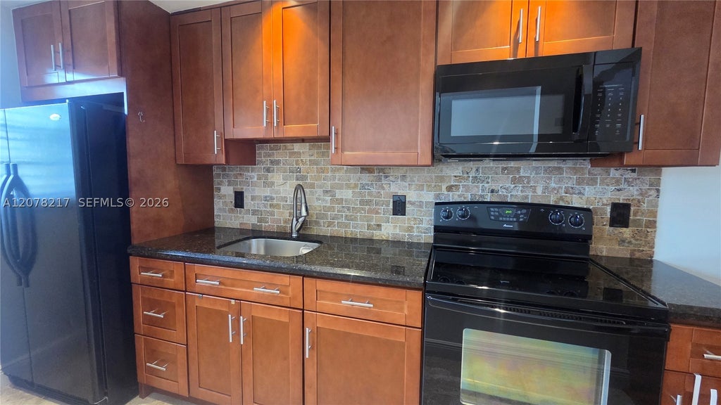 Photo of 415 NE 2nd St #105, Hallandale Beach, FL 33009 (MLS # A12078217)