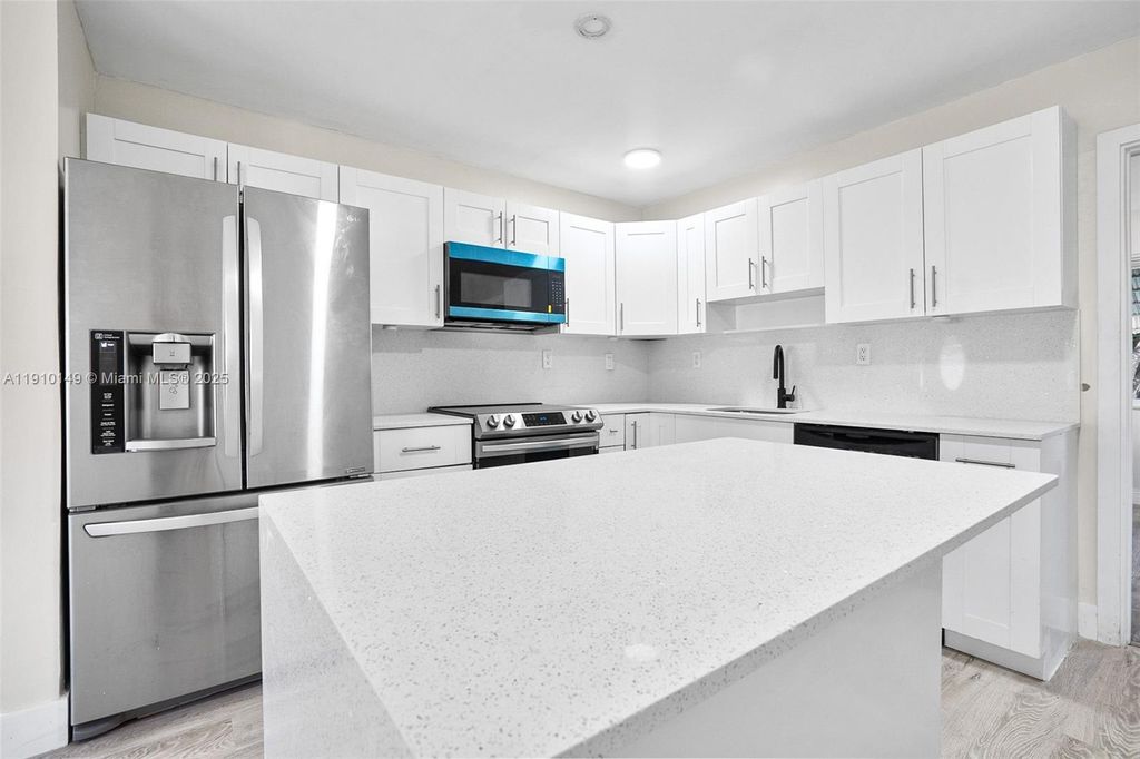 Photo of 7110 NW 57th Ct, Tamarac, FL 33321 (MLS # A11910149)