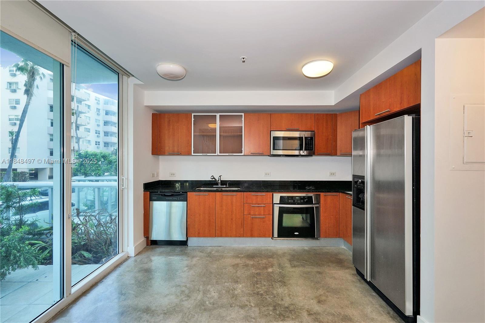 One of only three units of its kind, this unique loft-style, two-story condo in the heart of Edgewater offers exceptional privacy and a versatile layout perfect for a home office or creative studio. Featuring soaring 18-ft ceilings and hurricane-impact windows, the space is flooded with natural light. Enjoy your own private entrance and oversized patio, ideal for lounging or grilling with friends, plus one assigned parking space conveniently located behind your kitchen door. Platinum Condominium is a boutique building with 24-hour concierge and security, a heated lap pool, Jacuzzi, BBQ area, gym, spa with sauna and steam room, outdoor lounge, and business center. Located just minutes from Biscayne Bay, Miami Design District, Wynwood, Midtown, Miami Beach, Brickell, and major highways.