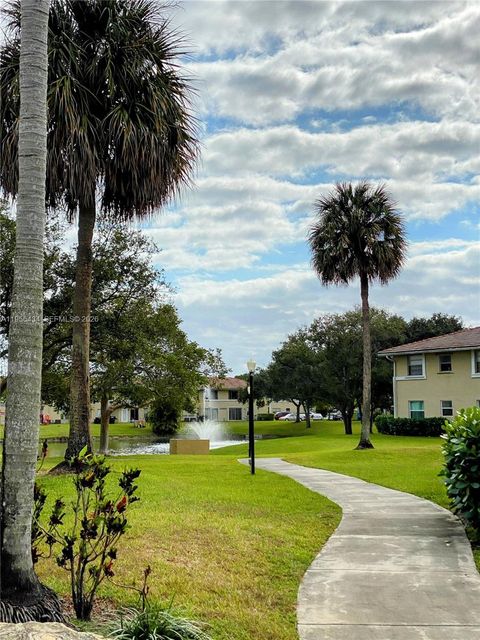 Photo of 900 Twin Lakes Dr #8-A, Coral Springs, FL 33071 (MLS # A11956434)