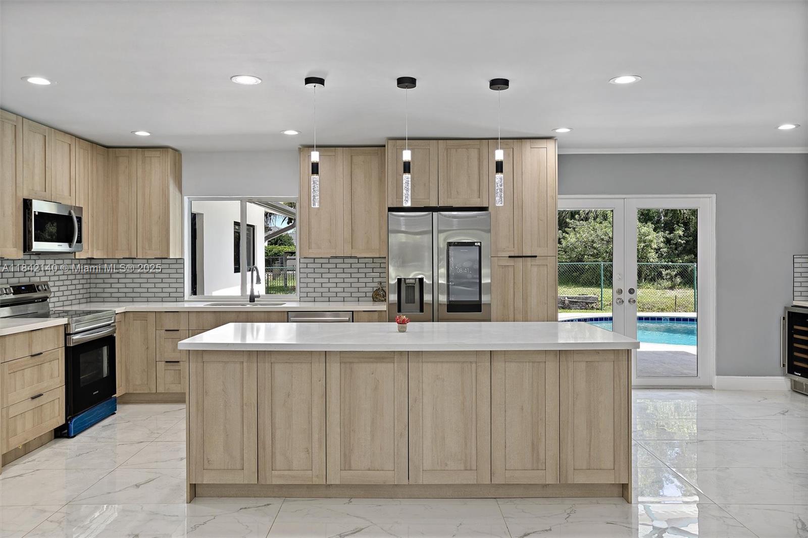 Live the elevated lifestyle in this fully remodeled Plantation Acres showstopper! Set on nearly 1 acre with peaceful canal views, this 4BD/3BA home blends modern luxury with timeless comfort in a prestigious no-HOA community. Everything is new: impact windows, kitchen, baths, appliances, porcelain floors, electrical panels, water heater, lighting, paint, and resurfaced pool. Fully fenced with room for RVs, boats, trailers, or a guest house—plus canal-side fishing in your own backyard. Near Prestige Heritage School, Sawgrass Mills, and major highways. Priced to sell, non-negotiable—land alone worth $1M. Don’t miss this rare opportunity—schedule your showing today!
