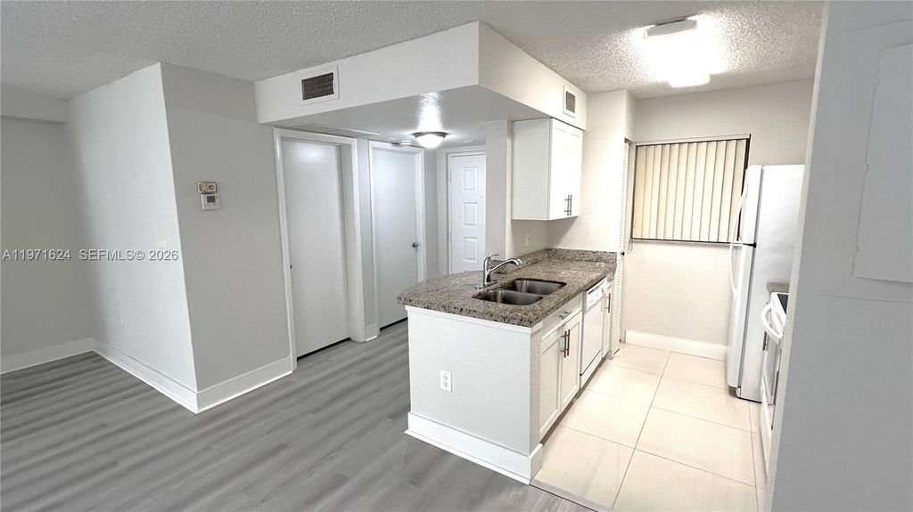 Photo of 2831 N Oakland Forest Dr #112, Oakland Park, FL 33309 (MLS # A11971624)