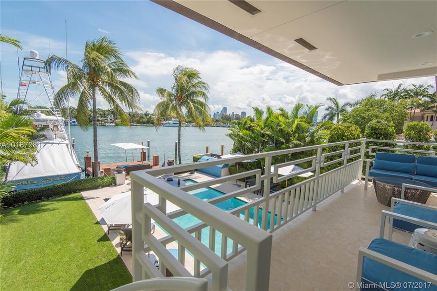 Newly redesigned and reconstructed, Boater's Paradise waterfront home by Ralph Choeff, featuring an over sized IPE dock that holds up to a 90-foot boat, located on renowned Hibiscus Island. Southern exposure with Miami skyline views. Open floor plan, master suite with balcony over looking the Bay, large walk-in closets, soaking tub, double shower. Top-of-the-line custom open kitchen with family room overlooking the swimming pool and bay. Impact windows, three dens, outdoor kitchen, two car garage and over sized driveway.