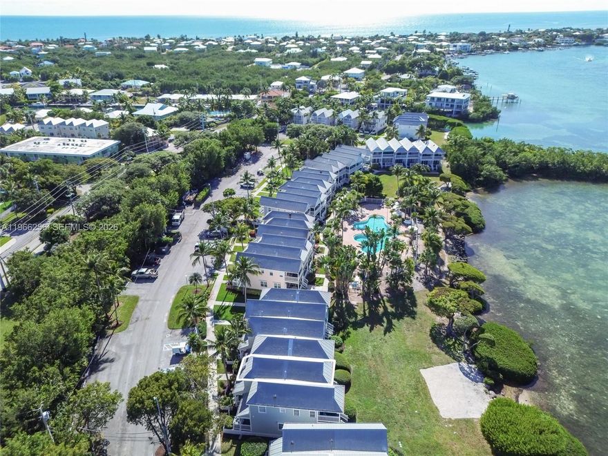 This 2-bedroom, 2.5-bath villa is ideally located in Sunset Village, offering open views of Tom’s Harbor and beautiful Florida Keys sunsets right from your backyard. Positioned within a prime resort setting, this property provides both comfort and convenience. The villa is being sold furnished. The renovated kitchen features a backsplash, granite countertops, updated stainless steel appliances, and recessed LED lighting. Additional features include accordion shutters for storm protection and a reinforced metal roof for added durability. Enjoy the spacious green lawn behind the property or relax at the Sunset Pool, located just steps away.