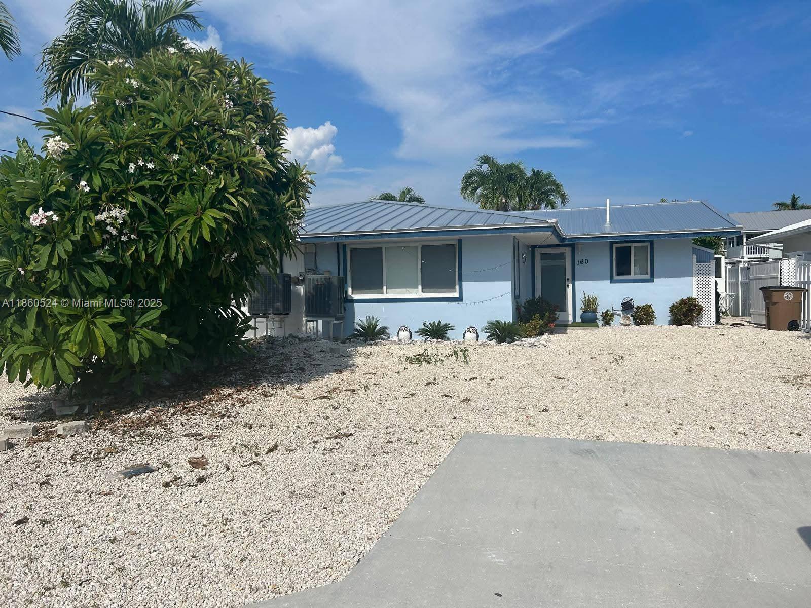 Step into this 2 bedrooms / 2 bathrooms Florida Keys paradise living lifestyle in very desirable and quite Key Colony Beach, Marathon neighborhood this quaint, beautiful, bright and relaxing home with boat dock and lift behind the home on wide canal with access to the open ocean, steps away from an open designed manicured backyard with hot tub and ample outdoor cooking options and additionally storage space. Inside you will find spacious floorplan with large bedrooms, remodeled bathrooms and kitchen with stainless steel appliances, ceramic floors throughout. Metal roof and recently installed impact windows. With option of expanding construction footage upward. WONT LAST !