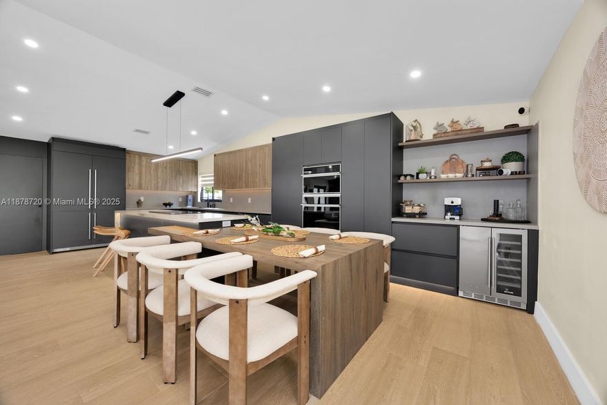 Welcome to Serenity House — a modern retreat defined by sleek design, an open atrium, and spa-inspired finishes that bring balance and style to daily living. Featuring 3 spacious bedrooms each with their private en-suite bathroom plus a powder room for guests, a 2-car garage, and impact windows/doors, this home spares no expense on brand-new upgrades. The luxury kitchen, complete with top-of-the-line appliances and a built-in dining area, opens seamlessly to the great room — perfect for entertaining. Each bedroom and bath feels like a private oasis, while the one-of-a-kind atrium offers the ideal space for gardening or meditation. Nestled on a cul-de-sac in the heart of Westchester, minutes from shopping and major highways, Serenity House is truly a must-see.