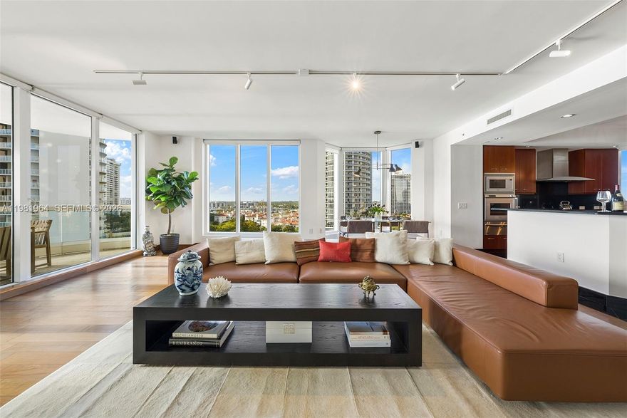 Magnificent corner residence in Bella Mare at Williams Island, masterfully designed by Haute Design Group and offering the largest primary suite layout in the building. This extraordinary 4-bedroom, 4.5-bath home spans over 4,000 sq. ft. of refined living space, where floor-to-ceiling windows frame breathtaking panoramic views of the bay, ocean, and Intracoastal from nearly every room. Elegant wood flooring flows throughout the residence, enhancing the bright, open-concept design ideal for both sophisticated entertaining and everyday living. The expansive living areas seamlessly connect to oversized terraces, creating a true indoor–outdoor lifestyle. The chef’s kitchen is equipped with premium Gaggenau and Miele appliances, custom cabinetry, and top-tier finishes. The residence features contemporary interiors, a premium surround sound system, and thoughtfully curated design details throughout. Bella Mare residents enjoy an exceptional collection of amenities including a resort-style waterfront pool, state-of-the-art fitness center, spa facilities, movie theater, library, card room, business center, and coffee bar. Located within the prestigious Williams Island community, residents experience a private resort lifestyle with a full-service European spa, championship tennis center, pickleball and padel courts, multiple dining venues, marina accommodating yachts up to 140 feet, scenic walking paths, dog park, playground, vibrant social calendar, and 24-hour gated security.