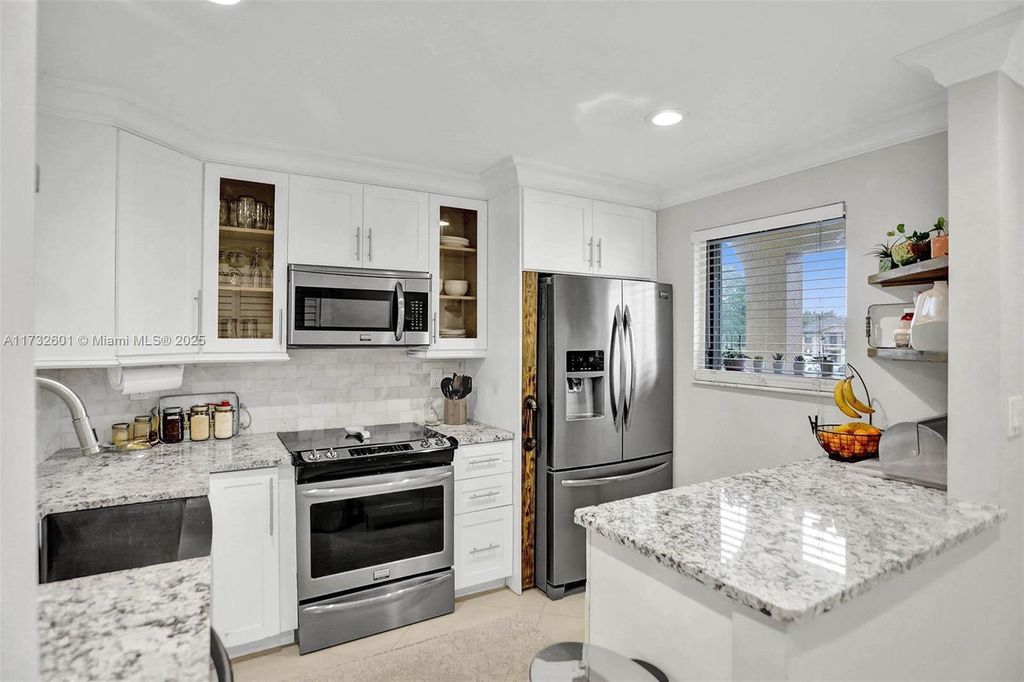 Photo of 9395 Boca Cove Cir #1208, Boca Raton, FL 33428 (MLS # A11732601)