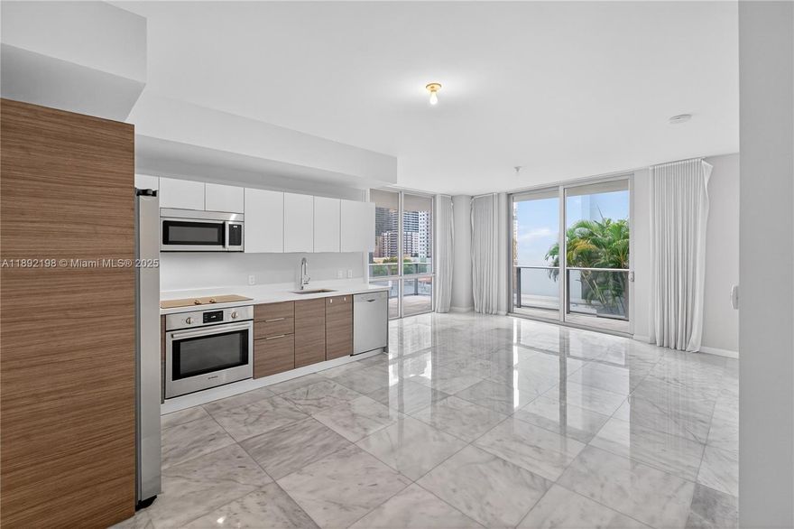 Tenant occupied until 06.30.2026. 5400$ Brickell Ten Condo: Modern living in this 2017-built, 1273 SqFt corner unit. Features 3 bedrooms, 1 enclosed DEN, 2 assigned garage parking spaces, and 1 storage unit. Enjoy a spacious 285.6 SqFt wrap-around terrace, open layout with 9’ ceilings, and floor-to-ceiling tinted sliding glass doors. Italian kitchen with quartz countertops, Bosch appliances, and in-unit washer/dryer. Amenities include rooftop gym, hot-tub and barbecue. 1600 sq ft pool, and social club with billiard on the 5th floor. Located just 1 block from Publix and 2 blocks from Brickell City Centre. Perfectly positioned for convenience and luxury