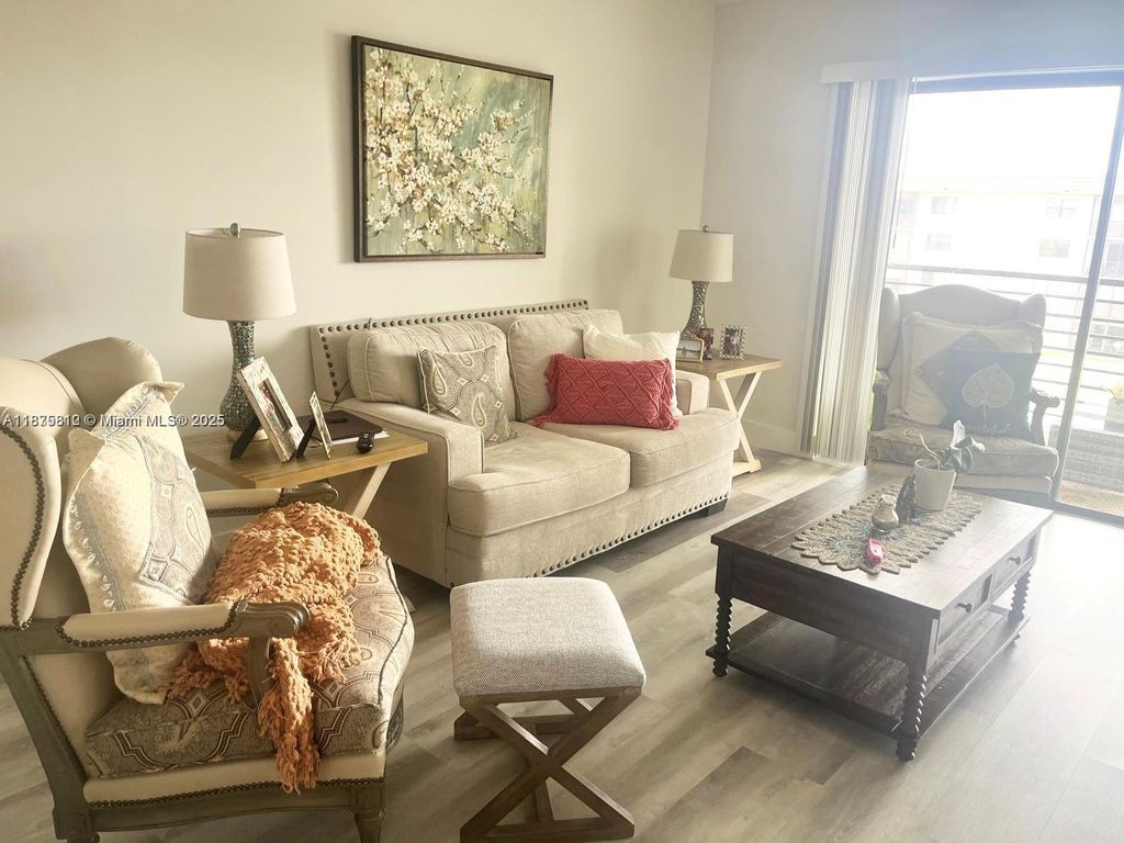 Photo of 4950 E Sabal Palm Blvd #407, Tamarac, FL 33319 (MLS # A11875812)