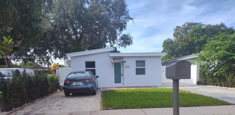 Beautiful, newly built little house with a newly installed roof, impact windows, fence, and more. The lot is 140 feet deep and houses a 2025 fifth-wheel RV that has not yet been used by anyone, and which you can use as a home. The house has a lease until the end of July 2026. The lot is a RM9, which allows for the construction of a duplex, complying with City of Hollywood regulations. This property has great potential for anyone who wants to live there, an investor, or even a builder.