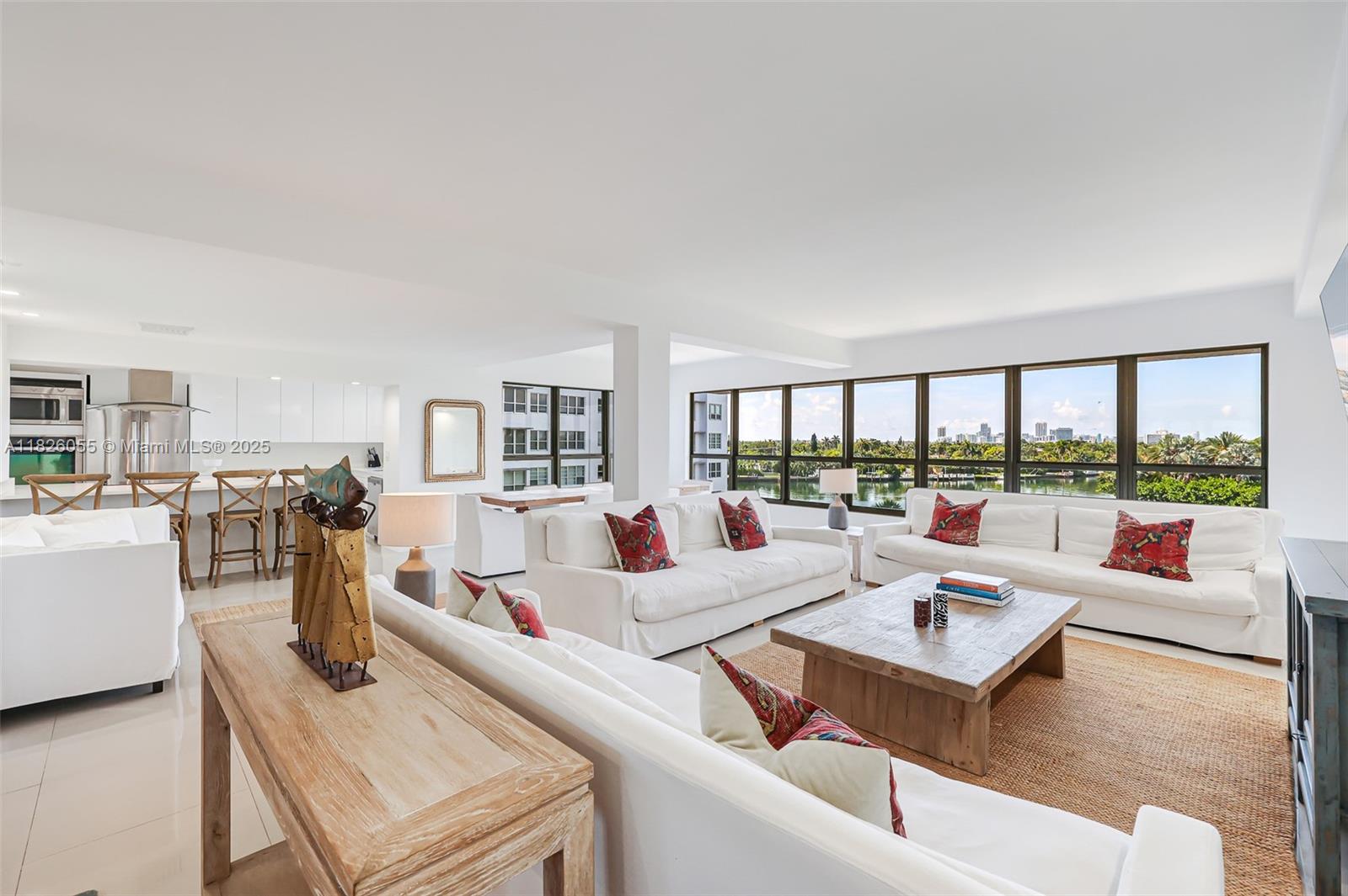 Experience the allure of newly installed impact windows in this stunning unit at The Blair House in Bay Harbor Islands. Upon entering this spacious 1820 SF condo with two storage units, you'll be captivated by breathtaking water views and an abundance of natural light. This elegantly updated residence features two bedrooms, two full bathrooms, and a convenient powder room, with panoramic vistas of the Miami Beach skyline and Indian Creek golf course from every room. Additional amenities include an in-unit washer and dryer, two storage rooms, and access to a beautiful boutique building just minutes from the beach and Bal Harbour Shops. Families will appreciate the nearby "A" rated K8 public school, while the building offers bicycle storage and a heated pool overlooking the water.
