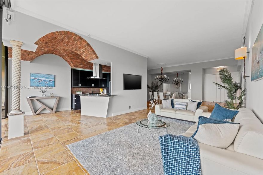 Experience penthouse living with breathtaking golf and city panoramas from a 50-ft balcony. This 2-bed, 2-bath residence spans 1,557 sq ft and blends architectural drama with modern sophistication. The featured vaulted brick ceiling and natural stone floors create a European-inspired ambiance, complemented by a remodeled kitchen with sleek cabinetry, granite counters, and mosaic accents. Spa-style baths showcase designer tile work and custom finishes, while motorized blinds add comfort and convenience. An assigned storage room on the same floor provides useful utility. The Consulate, a full-service tower within The Lands of the President, offers 24-hr security, pool and spa, fitness center, tennis, social room, and more. One assigned covered parking spot and plenty of guest spaces.