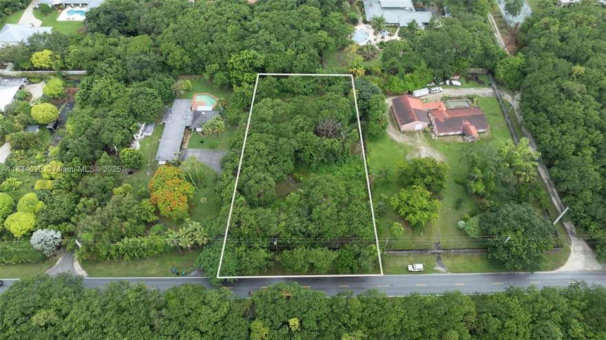 Prime 1.03-Acre Lot in the Sought-After Redlands! Take advantage of this rare opportunity to build in one of Homestead’s most desirable rural areas. This spacious lot comes with 80%-approved building plans and permits underway for a custom estate of over 4,000 sq ft, including space for a guest house. Zoned EU-1C, it also includes a Natural Forest Community (NFC) area with potential tax benefits. Surrounded by custom homes and across from the scenic 100-acre Camp Owaissa Bauer Preserve Park, the property already has water and electricity in place. Architectural renderings of the proposed home are included, offering a clear vision of what this stunning property could become. Don’t miss this rare opportunity to build on a large, ready-to-develop parcel in the heart of the Redlands.