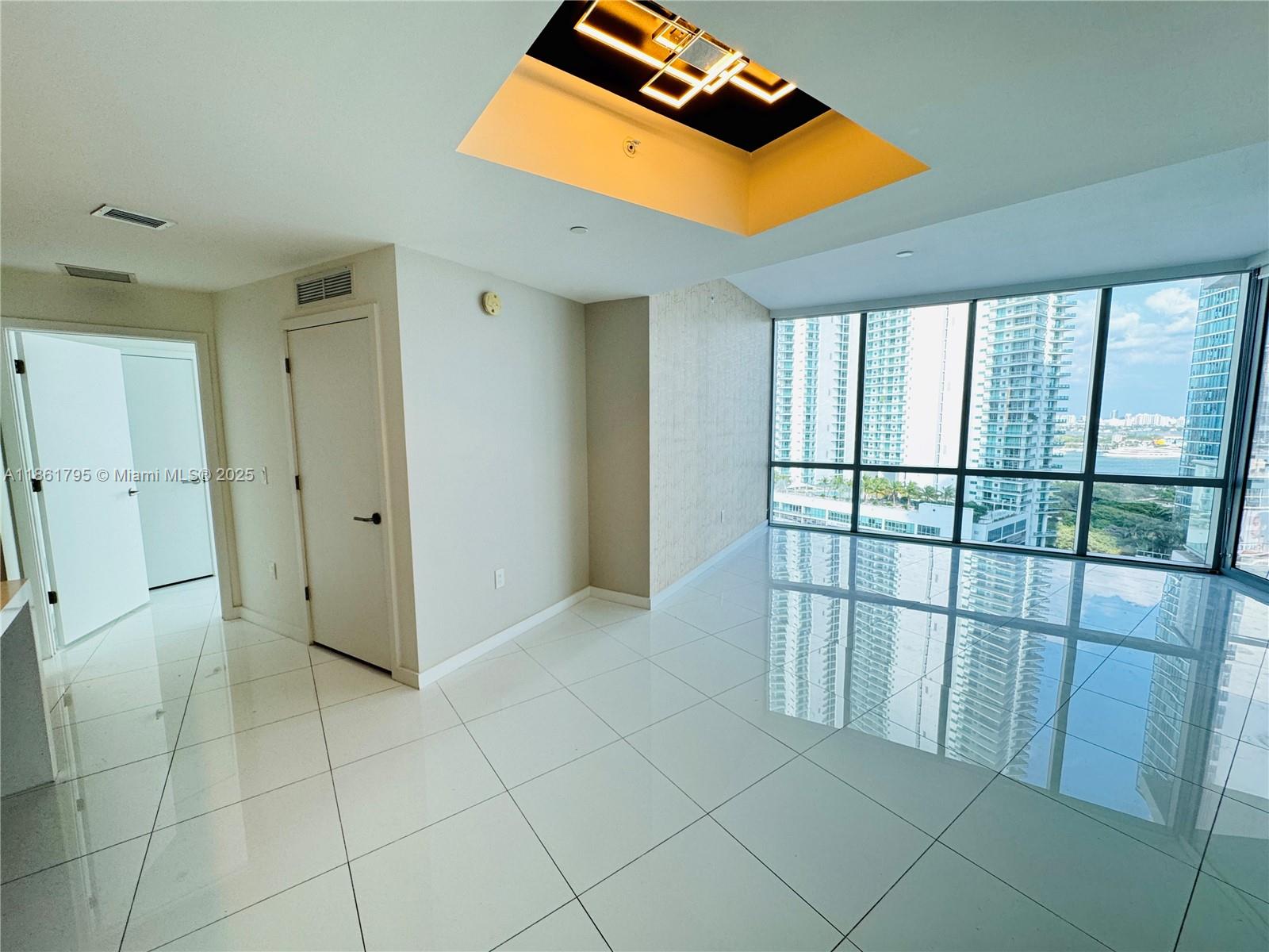 This stunning 2-bedroom, 3-bath luxury unit at Paramount Miami World Center offers an exceptional living experience. Featuring a private elevator, white ceramic floors throughout, and an oversized balcony with breathtaking sunset views of Miami, this home is truly one-of-a-kind. Enjoy built-out closets, blinds on all windows, and the convenience of 2 parking spots (1 valet & 1 assigned). The building boasts the world’s most amenities, including 5 pools, a spa, gym, basketball court, yoga studio, recording studio, racquetball, and more. With internet and cable included, this condo is perfect for both living and renting out. Don’t miss out on this incredible opportunity!----------UNIT RENTED TILL 5/31/2026, PAYS $6,100.00 PER MONTH - 24hs previous notice for tenant to open the door to show
