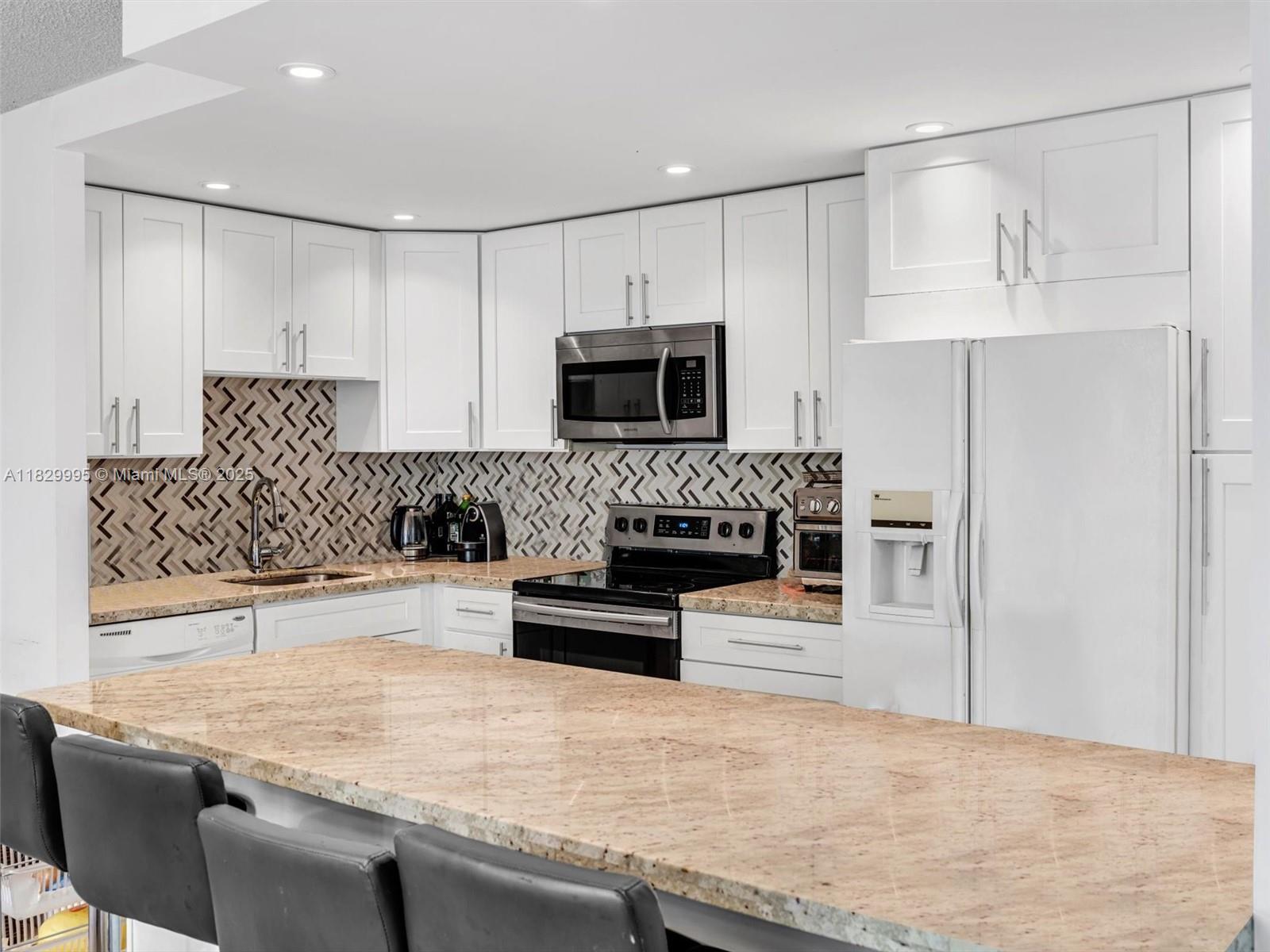 GREAT LOCATION in the heart of Aventura! Spacious 2 Beds/2 Baths unit in the desirable Villa Dorada community. Originally a 3-bed layout, third bedroom wall was removed but can easily be restored-closet, window, and door are still in place. This bright unit features a renovated kitchen w/granite countertops, in-unit washer & dryer, porcelain tile in the living areas, and laminate wood floors in the bedrooms. Enjoy a screened balcony, ample storage space, and 1 assigned parking spot. Villa Dorada offers fantastic amenities including two pools, fitness center, clubhouse, card room, BBQ area, and playground. Located along the Aventura Circle Exercise Trail and just steps from Aventura Mall, supermarkets, restaurants, parks, and more. Only minutes from the beach. Don't miss this opportunity!