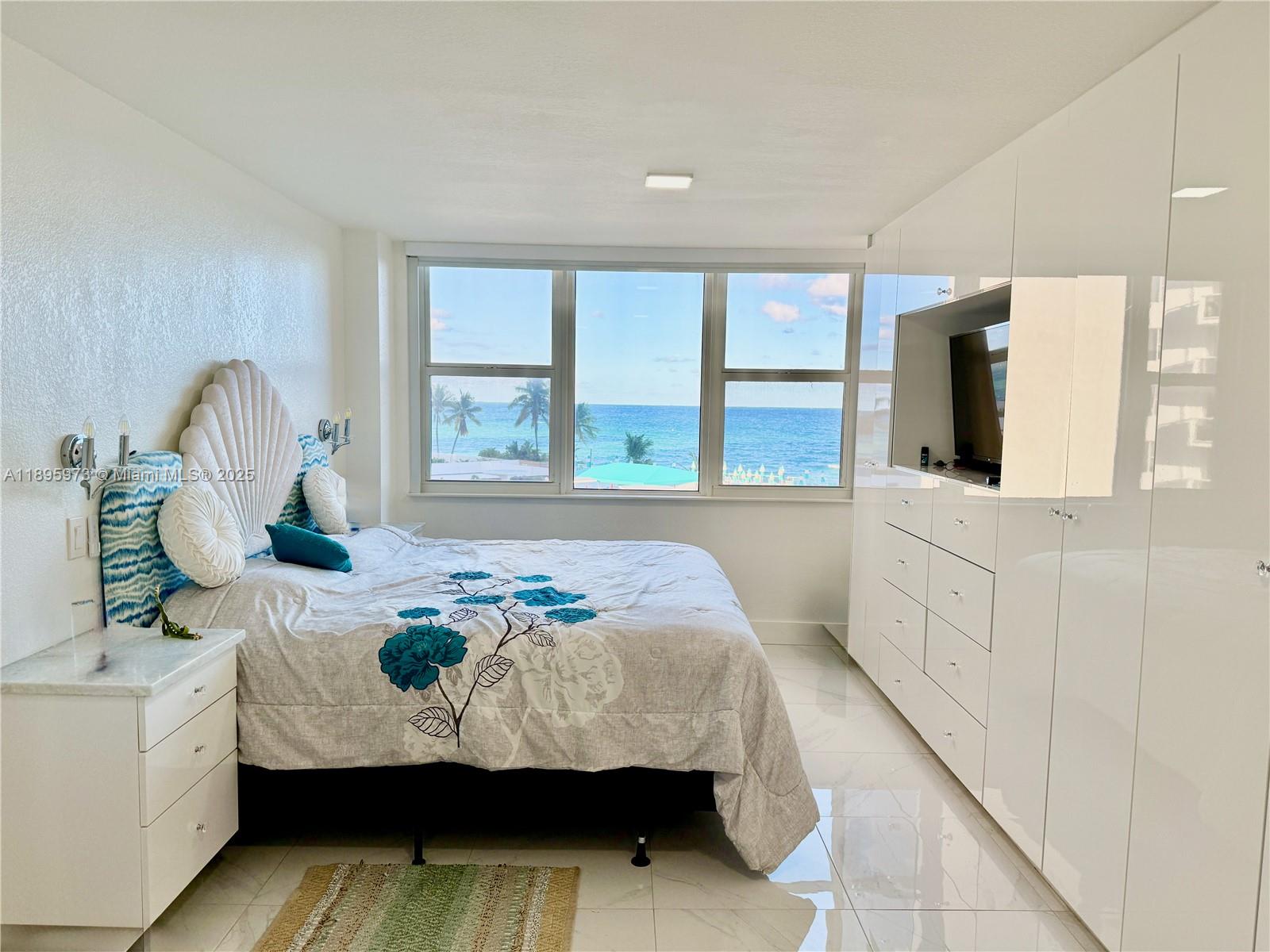 Fully Furnished, Available for 6 months or minimum 3 months.Experience coastal living at its finest in this fully furnished one-bedroom condo boasting breathtaking ocean views right from your bed. Wake up to the soothing sound of the waves and endless blue horizons. Though the balcony sliding door is temporarily closed due to building renovations, the stunning ocean scenery still fills the room with light and tranquility. This full-service building offers a wide range of premium amenities, from 24/7 security,a heated pool with a furnished sun deck, his and hers saunas, two fully equipped gyms (cardio and weights), a billiards & game room, & a club room ideal for entertaining.Enjoy direct beach access, BBQ areas, and convenient beach service. The unit includes one assigned parking space.
