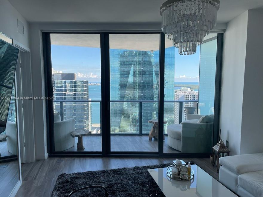 TURNKEY 1 Bedroom + DEN/ 2 Bath residence with breathtaking bay views from this stunning, light-filled residence at SLS Brickell in the heart of Brickell. Fully furnished. This open-concept kitchen boasts Bosch appliances, sleek quartz countertops, and an elegant design perfect for both everyday living and entertaining. Floor-to-ceiling windows flood the space with natural light, highlighting the exquisite wood porcelain flooring throughout. The custom walk-in closet provides ample storage. Take advantage of the rooftop pool, state-of-the-art gym, spa, kids' room, and dedicated spa area. On-site Fi'lia restaurant and Sam's Lounge Club. Ideally located within walking distance to world-class shopping, dining, and grocery stores. Don't miss out on this exceptional opportunity!