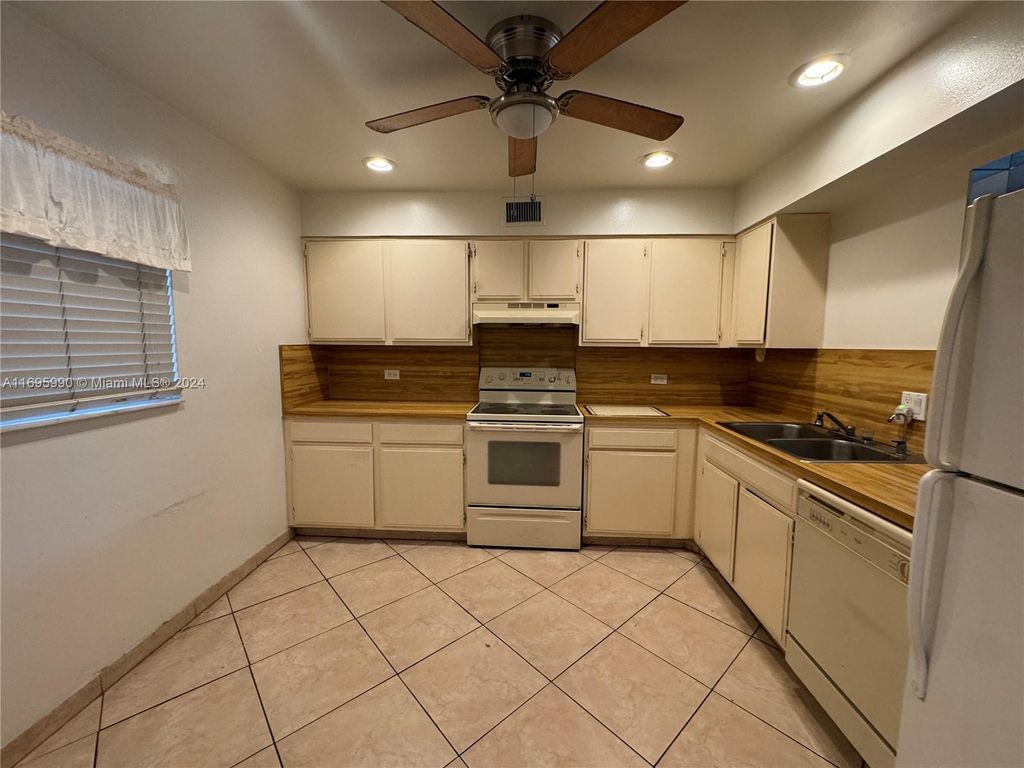 Photo of 7554 Stirling Rd #203, Davie, FL 33024 (MLS # A11695990)