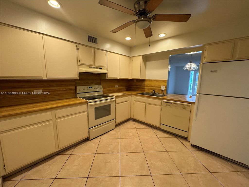 Photo of 7554 Stirling Rd #203, Davie, FL 33024 (MLS # A11695990)