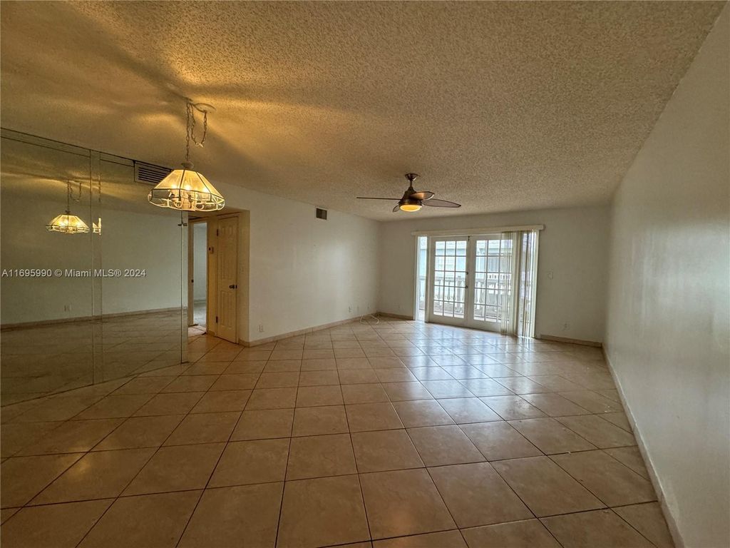 Photo of 7554 Stirling Rd #203, Davie, FL 33024 (MLS # A11695990)