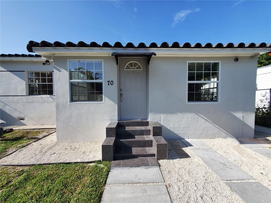 READY TO MOVE IN. Impeccable renovated home in prime Wynwood location. The main house offers 2 bedrooms and 1 bath, plus a separate 1 bed/1 bath efficiency with  Kitchenette and private entrance. Features include ALL new appliances, washer/dryer, security cameras, central A/C in main home, window A/C in efficiency, spacious closets, fresh paint, and a private driveway with additional street parking. Classic Spanish-style design with large front and back yards. Steps to Midtown, Design District, Wynwood’s vibrant core. Tenant may subleasing only the efficiency. Pets under 20 lbs with vet records accepted. Ideal for professionals, creatives, or small families seeking a stylish and functional space in one of Miami’s most desirable and walkable neighborhoods.