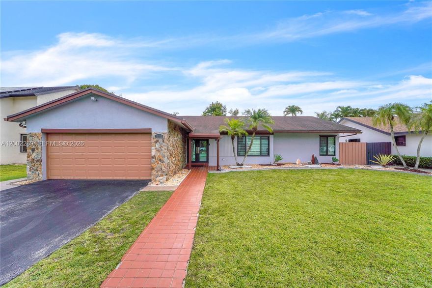 Welcome to 10615 SW 129 Ct, a beautifully updated 4-bedroom, 3-bathroom home in the heart of Calusa offering high ceilings, abundant natural light, and a clean, open feel throughout. A welcoming foyer entry sets the tone as you walk in, leading into spacious living areas with great flow, while the kitchen features stainless steel appliances, wood cabinetry, and easy connection to the main spaces. The bathrooms have been fully renovated with sleek, modern finishes, and the home offers generous closet space throughout for practical living. The backyard is a true highlight, designed for real entertaining with a pool, gazebo, summer kitchen, and cabana bath, plus plenty of space to lounge and host year-round. Additional features include a new washer and dryer with a dedicated laundry area off the garage, a newer roof, impact windows, and a 2-car garage, all in a prime Calusa location close to top-rated schools, parks, and everything you need.