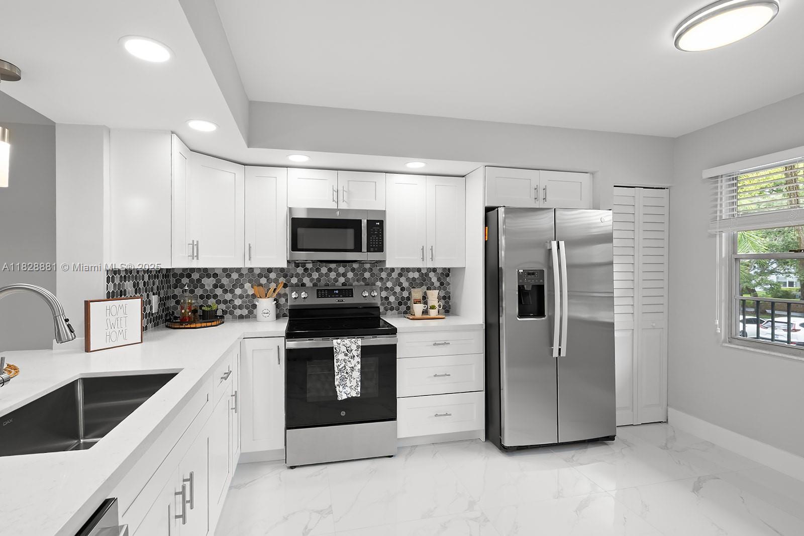 Welcome to this beautifully updated 2/2 unit w/a serene golf view that greets you as you enter the front door. This condo features all-new appliances, ceramic floors throughout, new balcony flooring, & newly plastered walls for a modern feel. Enjoy the convenience of an in-unit washer and dryer, a new hot water tank, and a 2-year-old A/C unit with a Nest Wi-Fi thermostat for energy-efficient comfort. Additional upgrades include a stylish barn door in the bathroom. The HOA is $512/month plus CVP $266/month, and includes water, cable, internet, and access to endless amenities, including a million-dollar clubhouse. Located in Buckingham East I at Century Village, one of Pembroke Pines’ most desirable 55+ active adult communities—minutes from The Shops at Pembroke Gardens and major highways.