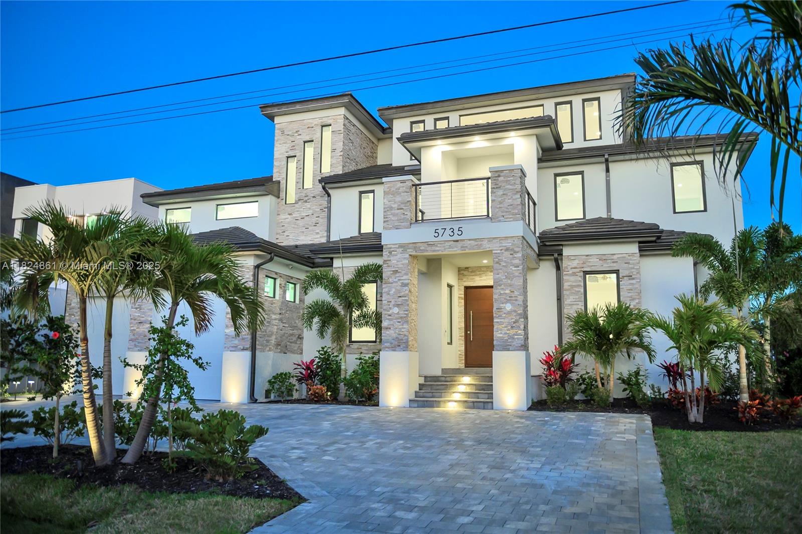 Stunning new construction ultra-luxury waterfront estate in Cape Coral w/10,463 adj. sqft and 80ft of waterfrontage. Inside, a grand living room with soaring vaulted ceilings & expansive floor-to-ceiling windows showcases panoramic views of the Caloosahatchee River. The open layout flows into a gourmet kitchen with imported Italian cabinetry & top-tier appliances. The primary suite includes a private balcony with breathtaking water views & spa-style bath with sauna. The 3rd floor features a multipurpose family room, large terrace & home theater setup. Additional features: private elevator, safe room & smart home tech. Outside, enjoy an infinity-edge pool, a wooden dock & tiki bar, perfect for entertaining. Thoughtfully designed to elevate every aspect of luxury waterfront living.
