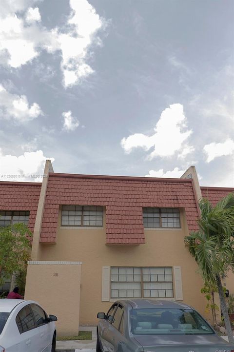 Photo of 35 Pleasant Hill Ln, Tamarac, FL 33319 (MLS # A11826093)