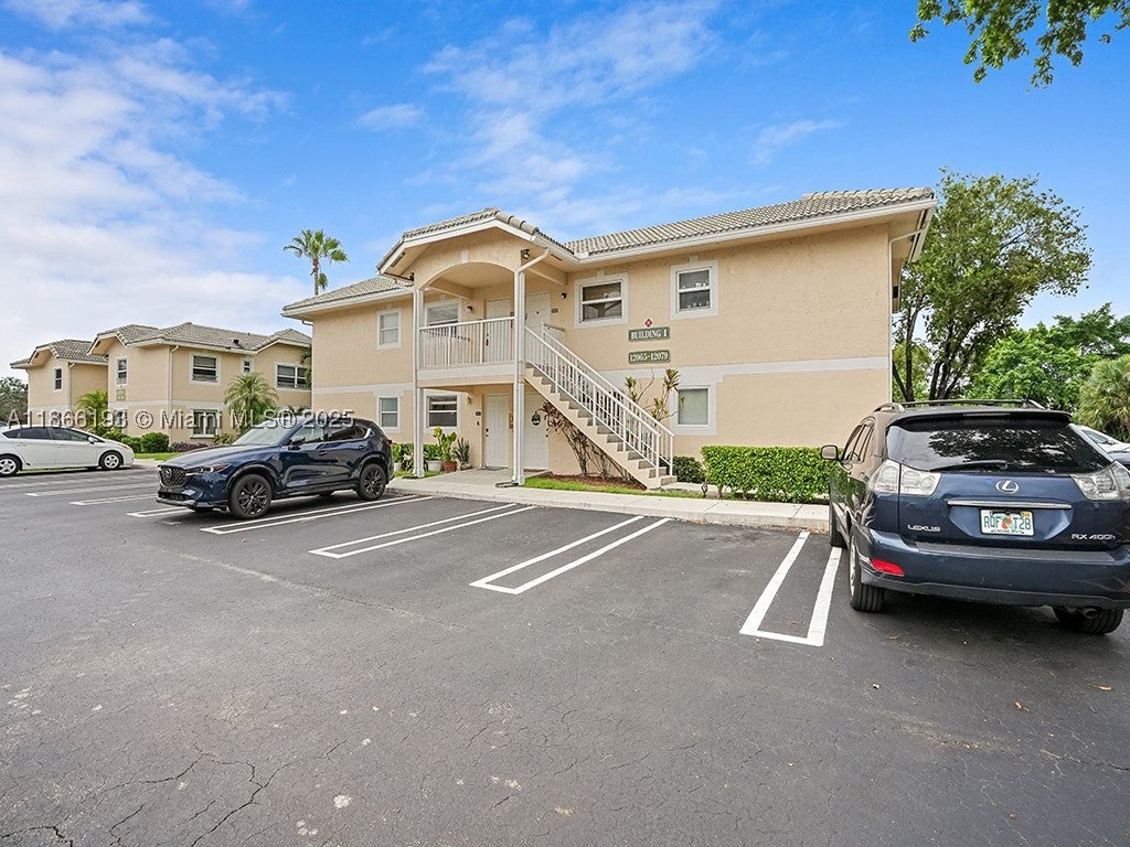 Photo of 12079 Royal Palm Blvd #8I, Coral Springs, FL 33065 (MLS # A11866193)