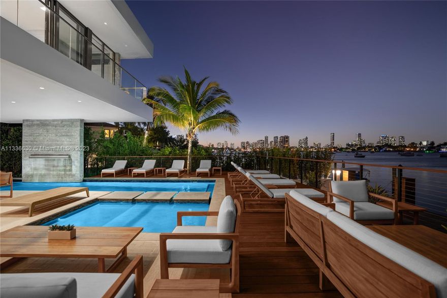 Stunning tropical modern home with westerly sunset views located on prestigious Hibiscus Island with 24/7 police guarded gated entrance. Wide bay Biscayne views upon entry to this luxury home, masterfully designed in 2017 by award-winning architect Choeff Levy Fischman. Indoor/outdoor living on ground floor is perfect for entertaining with its open dining and family areas, with five bedrooms and office area, spacious master bedroom with dramatic water views. Featuring custom Italian kitchen, oak wood floors, Crestron smart home system, floor to ceiling windows and a two car garage. New Ipe rear deck decking with expansive relaxing outdoor area, and lush landscaping provides resort style oasis rear yard including a salt water pool and spa, and private dock.