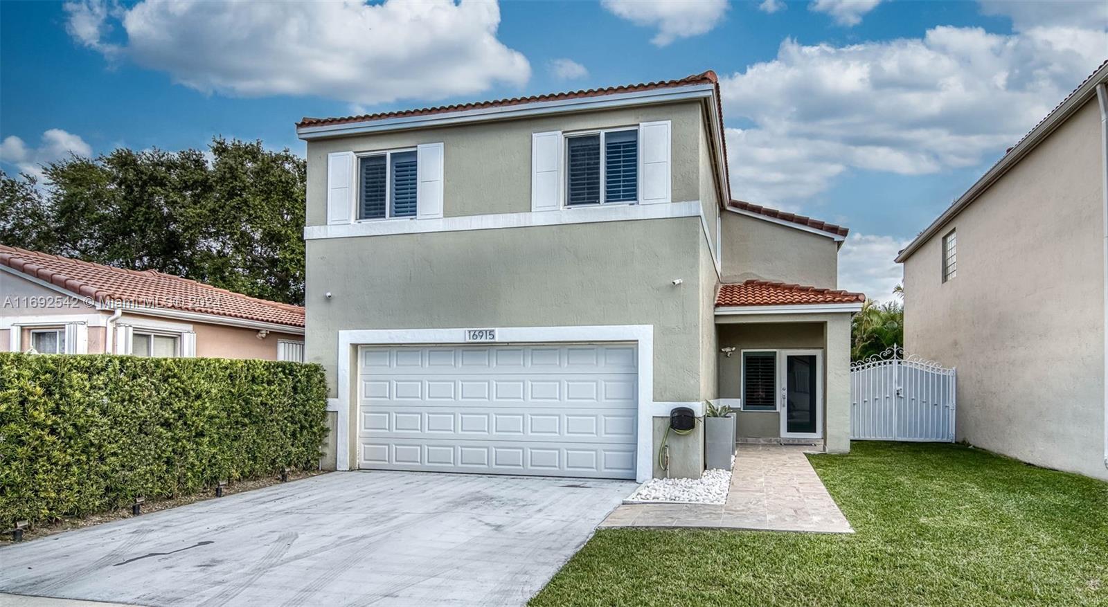Spacious and modern! 2-story single-family home with a large yard & plenty of room for a pool! This beautifully updated home features impact windows and doors, a bright updated kitchen that boasts a large island & an open living floor plan that is perfect for entertaining. Soaring vaulted ceilings add elegance to the living area, with stylish tile flooring throughout main level. All bedrooms are conveniently located on the second floor, featuring updated wood laminate flooring. The primary suite includes two roomy closets and an updated en-suite bath with a spacious walk-in shower. French doors open to your ample patio, ideal for outdoor relaxation. Additional highlights include a 2-car garage, ample driveway space & the potential to create your dream backyard oasis. Shown by appointment.