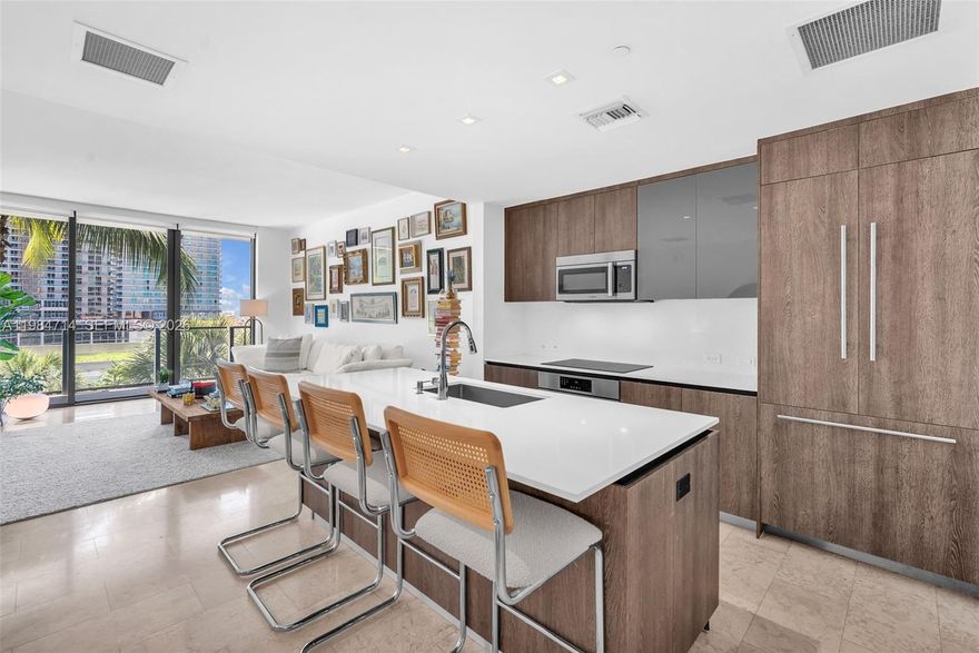 This beautifully appointed residence boasts an open-concept layout with sweeping views of the garden, city skyline, and Miami River. Contemporary finishes, marble flooring throughout and 10-foot ceilings, provide an abundance of natural light. A spacious 200 sq. ft. terrace, accessible from each room, extends the living area outdoors. The kitchen features premium Bosch appliances, wine cooler, ItalKraft cabinetry + custom-designed closets. Reach is a full service luxury tower located within the internationally acclaimed Brickell City Centre, residents enjoy world-class dining, upscale shopping, and vibrant city living right at their doorstep; 15 minutes to Miami International Airport and 20 minutes to Miami Beach. One deeded parking space included.