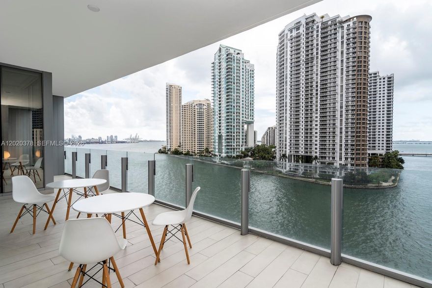 Experience waterfront living at Aston Martin Residences in Miami. This residence offers 2 bedrooms and 3 full baths across 1,388 SF, with an open balcony and wide water views of Biscayne Bay, the Intracoastal, and the Miami River. Interiors feature marble flooring, built-ins, a cooking island, and easy elevator access. Enjoy a doorman and secured entry, plus amenities including a pool, sauna, exercise room, clubhouse/clubroom, business center, and dock access. Pet-friendly building with one assigned parking space.