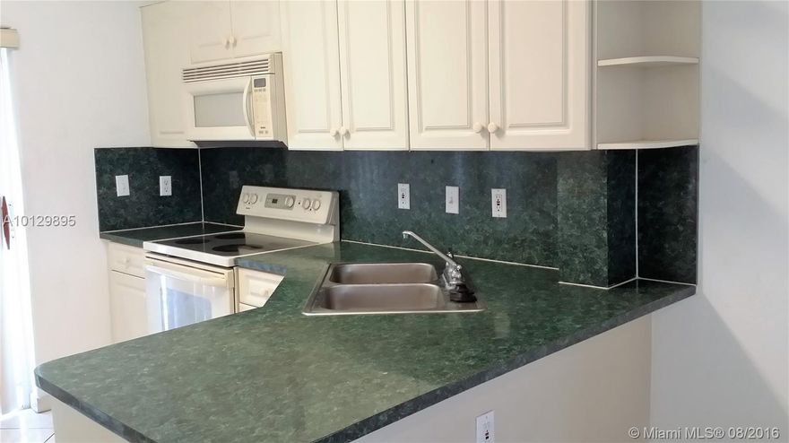 Beautiful second floor condo with two master bedrooms, vaulted ceiling, huge balcony, tiled floor, washer inside unit at W. Okeechobee Rd, near Palmetto Expressway, Walmart, Target and schools. Community has basketball court and BBQ area. Parking is in front of the unit.