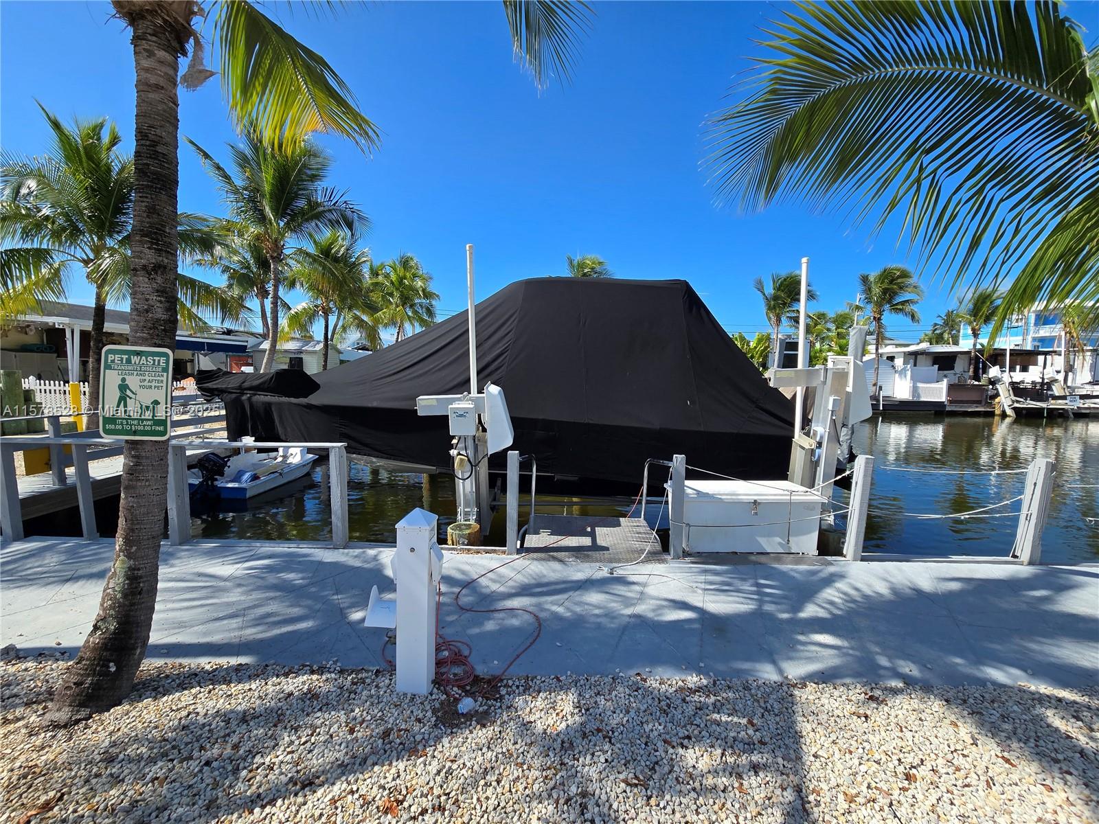 When you are looking for a vacation place, or for investment. This community offers it all. Your rental could be 1 day or 365, your choice. Owning, it is a great location, corner lot with 40 feet of dock space for your boat and a 15000 lbs. boat lift ready to use. This community offers lots of amenities, boat ramp, pool, sun deck, sun sets, tennis and basketball courts. Come tour it today, you will be impressed.