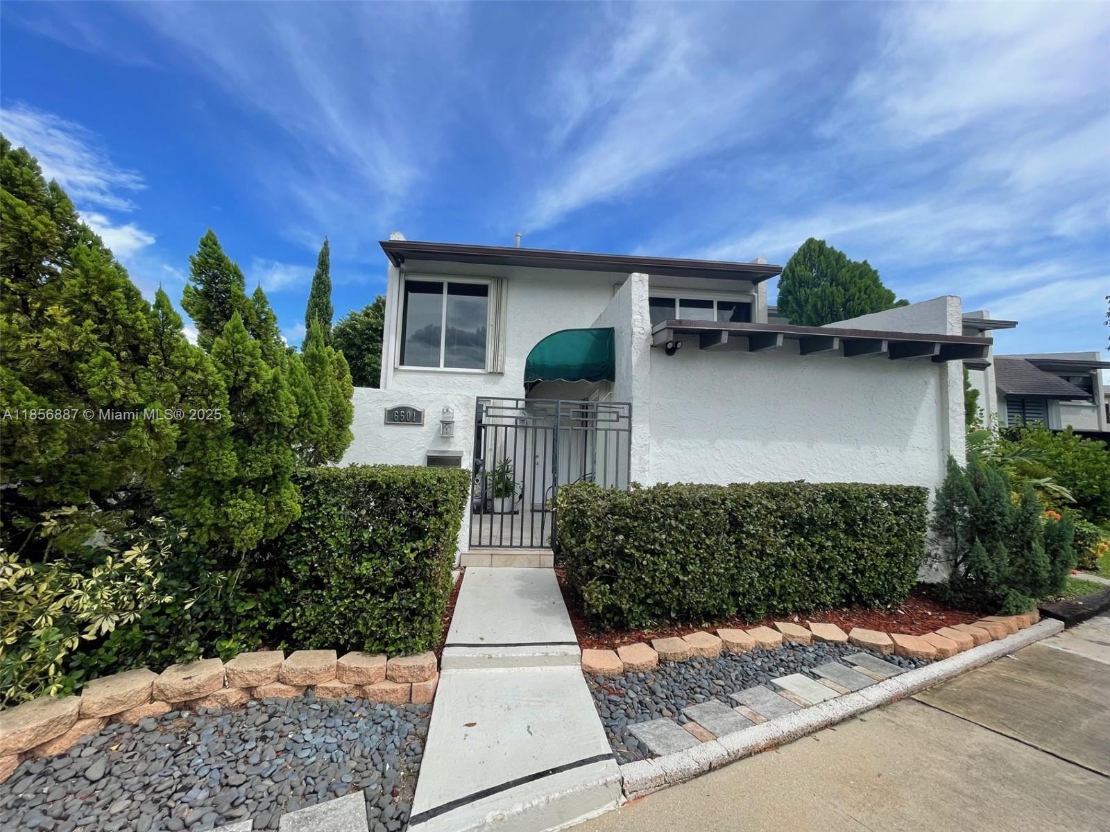 Gorgeous remodeled Corner TH, decorator designed showplace! Courtyard entrance all tiled. Kitchen window with view of Zen Gdn, granite, New-Range,Washer,Dryer & Gas WH. Granite snack counter also! Large tile flooring, wood staircase & sturdy handrails. Bedroom on 1st floor- French Drs to Courtyard! Upstairs two bedrooms, walk in closets & lots of storage. 2023 Roof! Serene views of park & gardens! One of the largest lots with huge wrap-around patio & no neighbors! French drs to the peaceful terrace, Zen gdn, mature tree canopy & a lovely green expansive park! Complete Accordion shutters, Impact picture window showing off the beautiful staircase. Low Maint Fee-providing gate entry, security & amenities. No approval & pet friendly, no restrictions. Parking for 3 vehicles in front of unit.