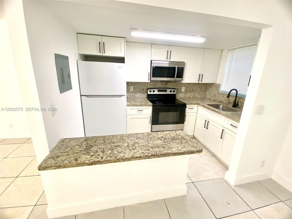 Photo of 850 SW 74 Ter #1, North Lauderdale, FL 33068 (MLS # A12002575)