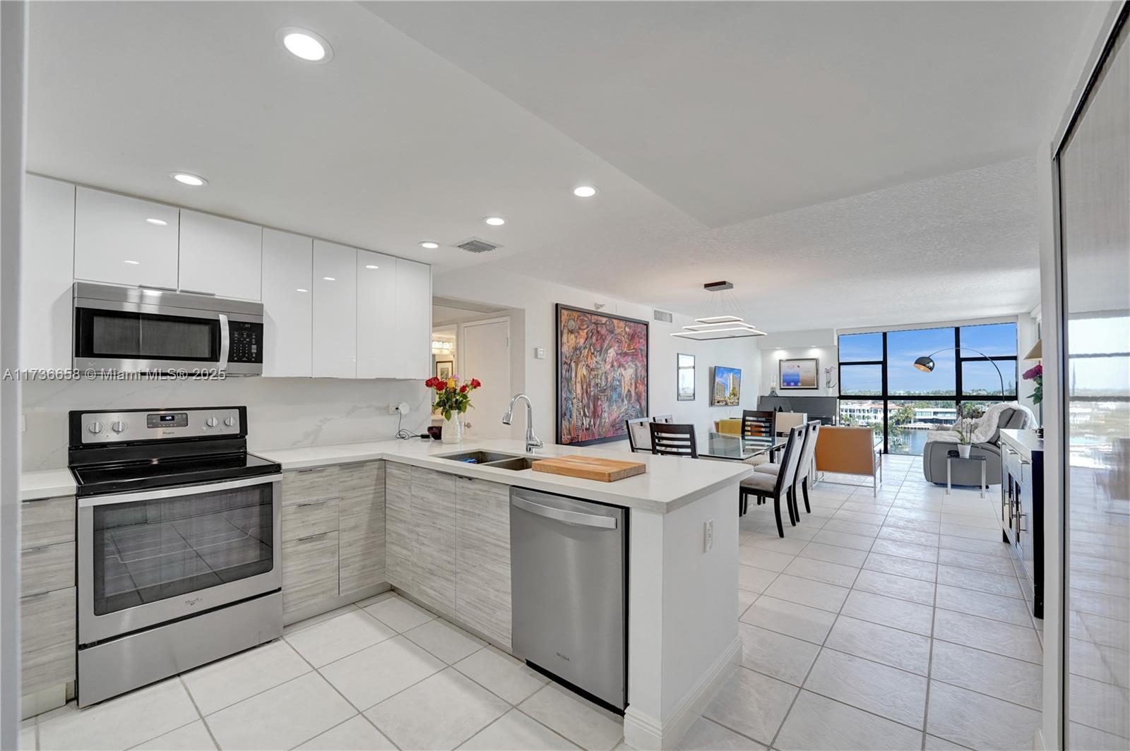 Your dream home experience begins now. Enjoy waterfront living from this wonderful corner unit offering 1,138 square feet of living space with 2 BD & 2 baths. Spacious layout, providing abundant natural light. The open kitchen features ample countertop space and a bright, airy atmosphere. It has been completely remodeled with quartz countertops, a stylish backsplash, and glossy wood cabinetry. The stainless steel appliances and open, modern design create a sleek, contemporary look. Recessed lighting in the living room and second bedroom adds a touch of elegance. Panoramic views. Large windows and bright lighting throughout create a warm and inviting ambiance. Two balconies, to enjoy the scenic vistas. The neutral color palette contribute to a modern, cohesive aesthetic. Great location.