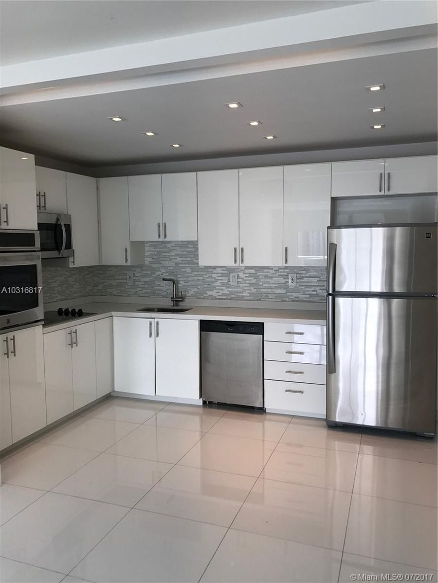 Completely remodeled unit, Brand new kitchen, ultra white porcelain floors and wood floor on bedrooms. Open Kitchen quartz countertop. beautiful bathrooms, Beautiful intracoastal views. Open balcony. Building has been renovated with an amazing lobby. Great location , walking distance to all restaurants in sunny isles and to the beach.