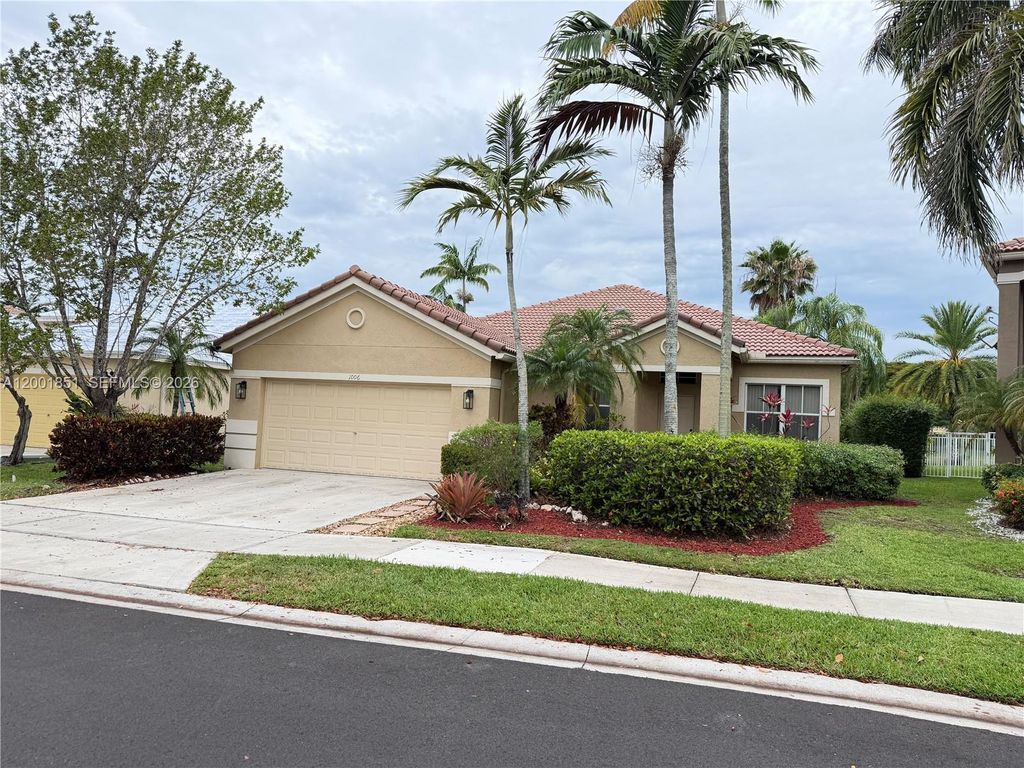 Photo of 1006 Sunflower Cir, Weston, FL 33327 (MLS # A12001851)
