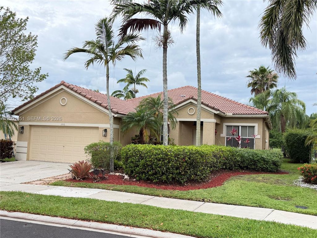 Photo of 1006 Sunflower Cir, Weston, FL 33327 (MLS # A12001851)