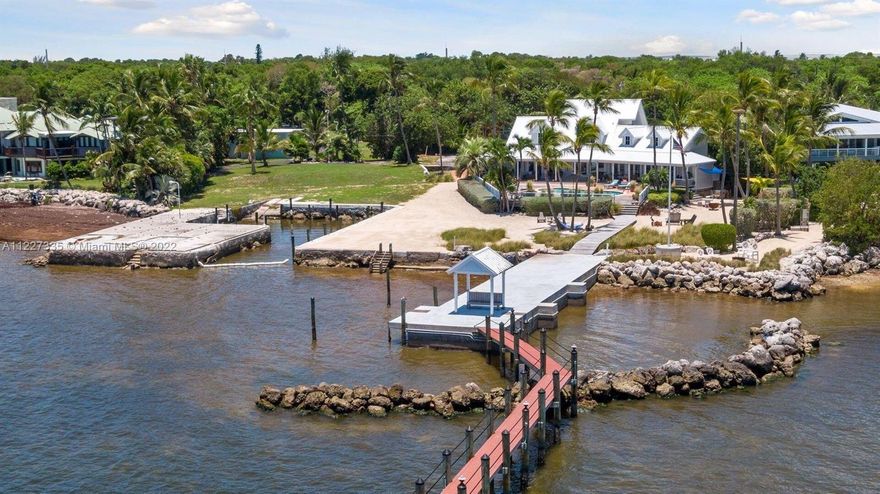 OPPORTUNITY AWAITS ~ Oceanfront Estate property package. Why have 2 acres when you can have 4 acres and more opportunities? TWO contiguous prime OCEANFRONT PARCELS – One developed with home, guest cottage, detached garage and pier dock, ready for your personal enjoyment! The other parcel is natural to combine with the home for a grand size parcel and estate, it includes a garage, boat basin and building right for a new home. Live in one home and build on the other. A wonderful family compound or corporate retreat. Two independent oceanfront parcels. You will discover an absolutely sublime oceanfront pool home estate on the northern parcel. Prepare to be entranced from the moment you enter the property with the lushly landscaped gated entrance that brings you down the winding driveway.