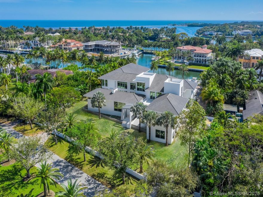 Incredible OPPORTUNITY to finish this custom modern home designed by famed architect Ramon Pacheco, the exclusive gated community of Gables Estates.  Currently 80% complete and ready to put the finishing touches. The home features 9 beds, 11/2 baths, 20,726 Total SF, 1.25 Acre Lot, & 220 ft of water-frontage with a new 140 ft dock. Huge Master suite, 6 additional en-suite bedrooms & 2 bedroom staff quarter. Courtyard with garden and water features in the center of the property. Library/Office with private entry from courtyard. Glass Wine Cellar, Elevator, In-home Health and Wellness Center, and much more. Currently $17,750,000 as is for the current state of construction. Also for sale fully finished for $22,500,000.