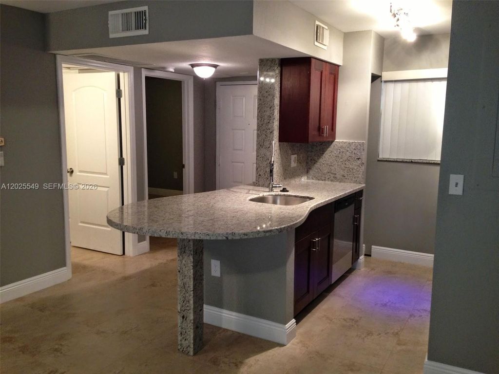 Photo of 2850 N Oakland Forest Dr #112, Oakland Park, FL 33309 (MLS # A12025549)