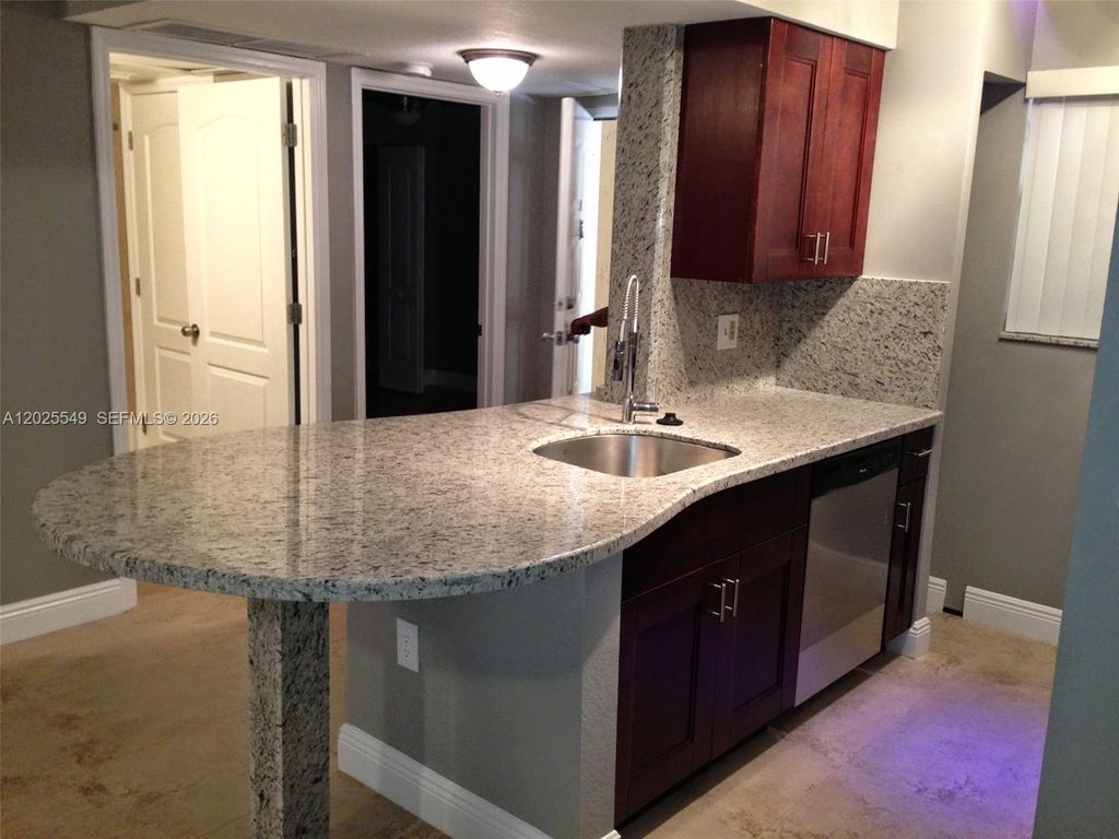 Photo of 2850 N Oakland Forest Dr #112, Oakland Park, FL 33309 (MLS # A12025549)