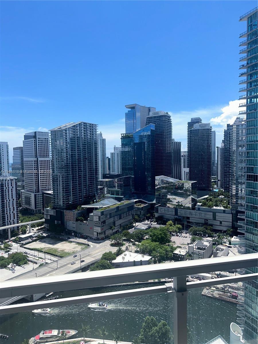 Bright and spacious 2 bed/2 bath condo at The Ivy, a gated riverfront community in the Brickell area. Oversized balcony offers sweeping city and river views, perfect for relaxing or entertaining. Excellent location near Brickell City Centre, Mary Brickell Village, Metro Rail, top restaurants & nightlife. Residence features fresh paint, a flexible dining/den area, and new washer/dryer. Both bedrooms are en-suite, providing comfort and privacy—ideal for families, roommates, or guests. The open layout and large balcony create great flow for entertaining. Primary suite includes a spacious bath and generous closet space. Resort-style amenities include pool, spa, fitness center, kids’ play area, party room & 24-hr security. Rent includes water, cable, amenities and 1 parking spaces.