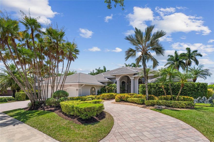 Stunning single-story estate in the exclusive Weston Hills Country Club, set on an oversized 0.41-acre waterfront lot with over 5,800 total square feet. This exceptional residence showcases soaring ceilings—higher than any other floor plan—and an elegant, open design throughout. Featuring 6 spacious bedrooms, 5.5 luxurious bathrooms, and a 3-car garage, the home has been beautifully updated with polished marble floors, fresh interior paint, a new roof, three new A/C units, and all-new impact windows and doors.  Designed for both grand entertaining and everyday living, the spectacular chef's kitchen boasts the latest in contemporary design and premium finishes, all overlooking the resort-style pool and breathtaking infinity lake views. Located within a prestigious golf course community and zoned for top-rated A+ schools, this remarkable estate offers the ultimate Weston lifestyle.